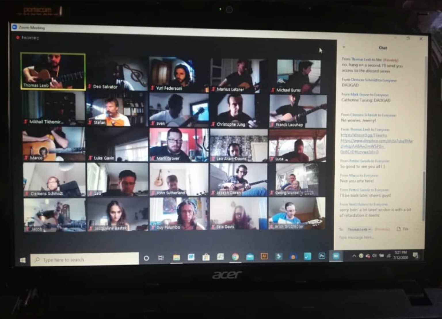 Photograph of Thomas Leeb teaching an online masterclass with guitarists attending by video